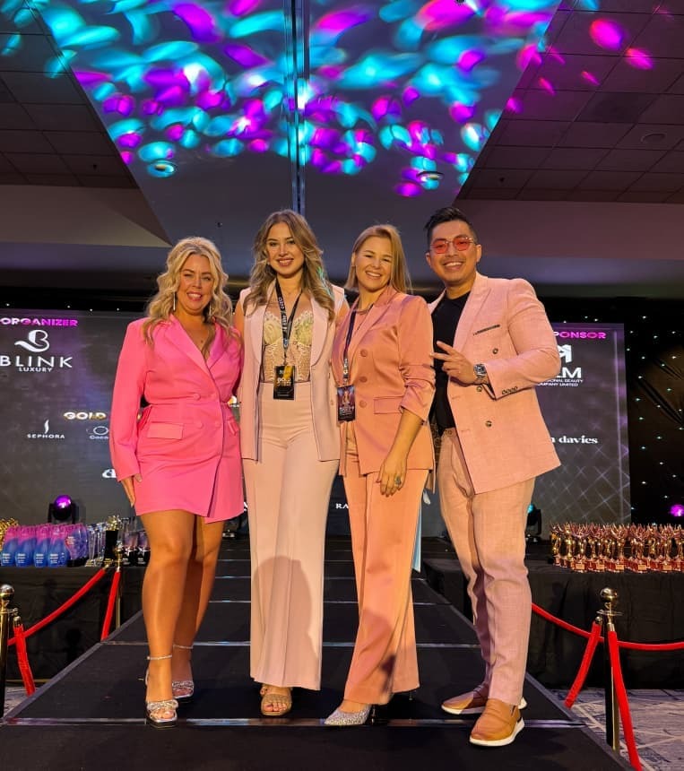 Kyla Paris receiving a Skin Games award for excellence in aesthetics